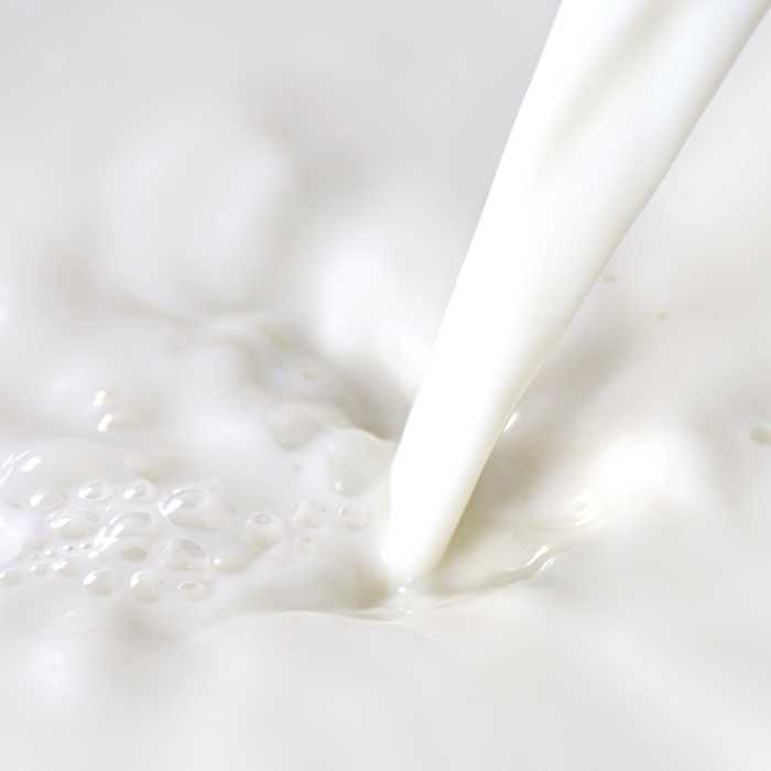 Milk being poured with bubbles | Anaphylaxis reaction triggers